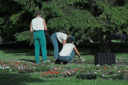 A local turfing team preparing soil before laying lawn turf in Hoxton